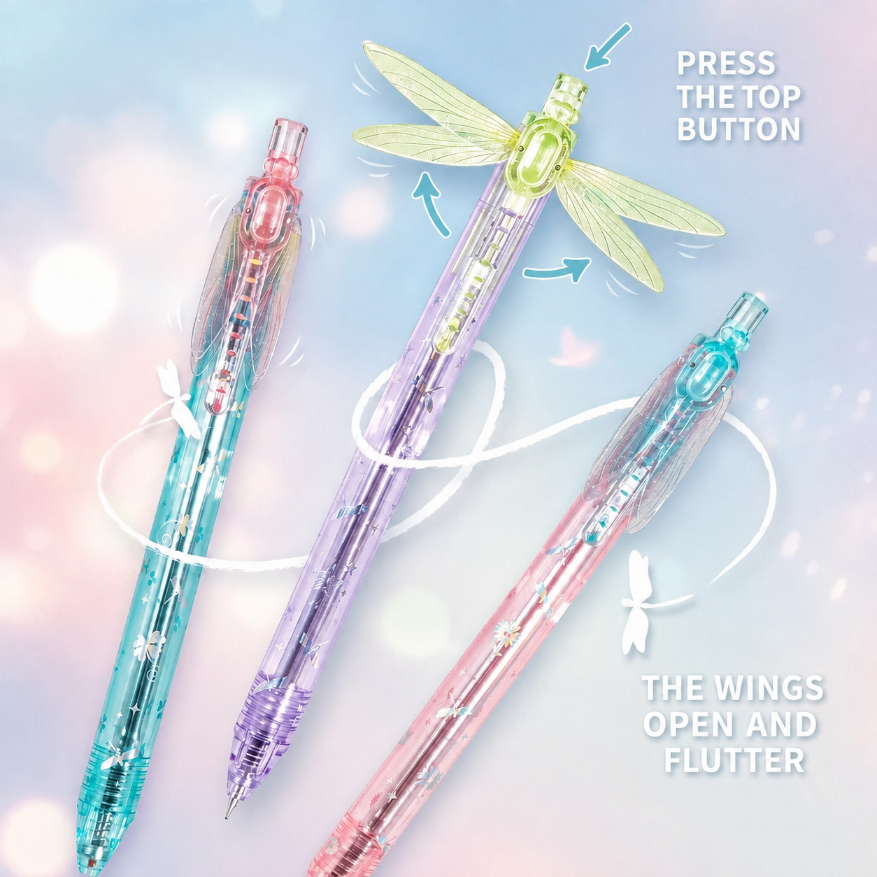 Three Gleaming Wings pens showing the top button and moving wings